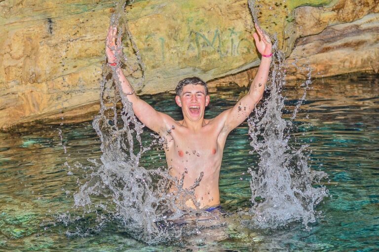 Canelotours Atv Buggy Excursion In Punta Cana Boy Splashing Water Cave Pool